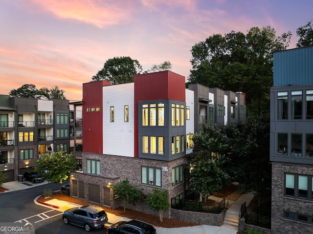 view of outdoor building at dusk