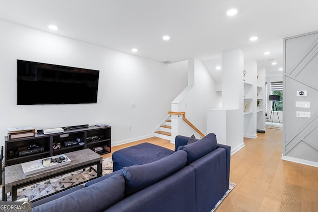 living room with light hardwood / wood-style flooring