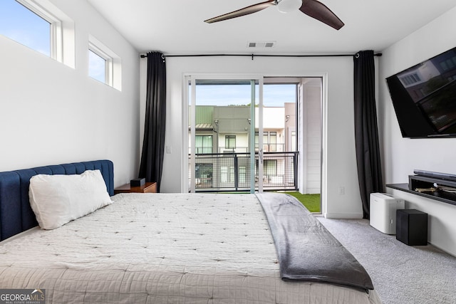 bedroom with carpet floors, access to exterior, multiple windows, and ceiling fan