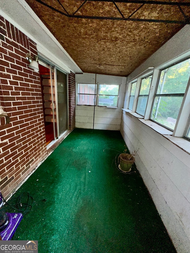 unfurnished sunroom with a wealth of natural light