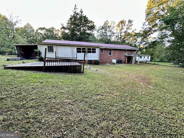 rear view of property with a lawn and a patio area