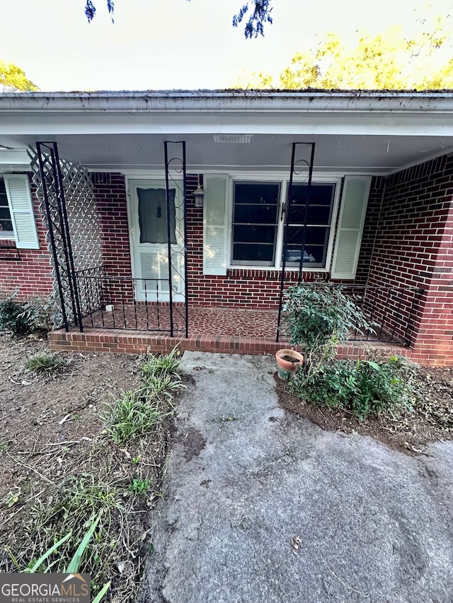 entrance to property with a porch