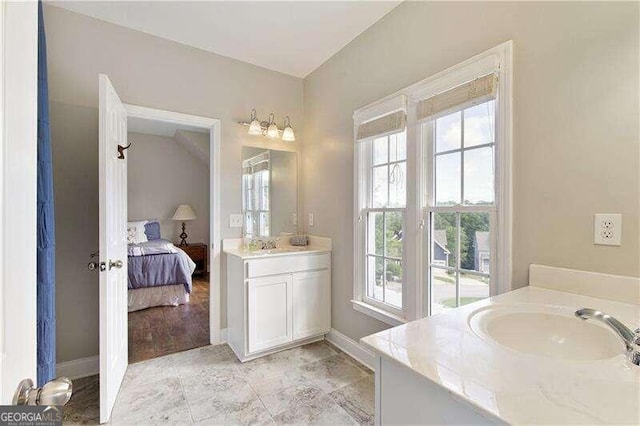 bathroom featuring vanity and a wealth of natural light