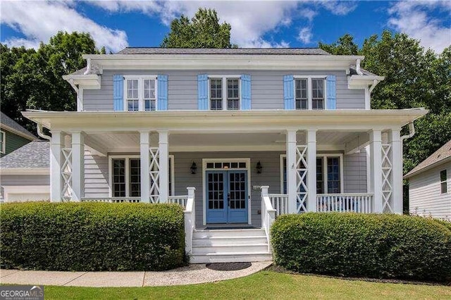 property entrance featuring french doors and covered porch