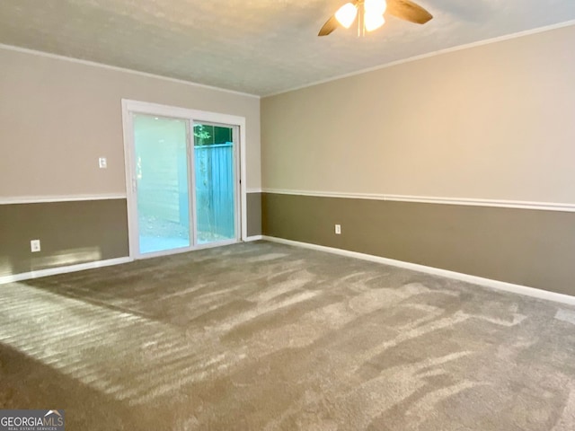 unfurnished room with ornamental molding, carpet, and ceiling fan