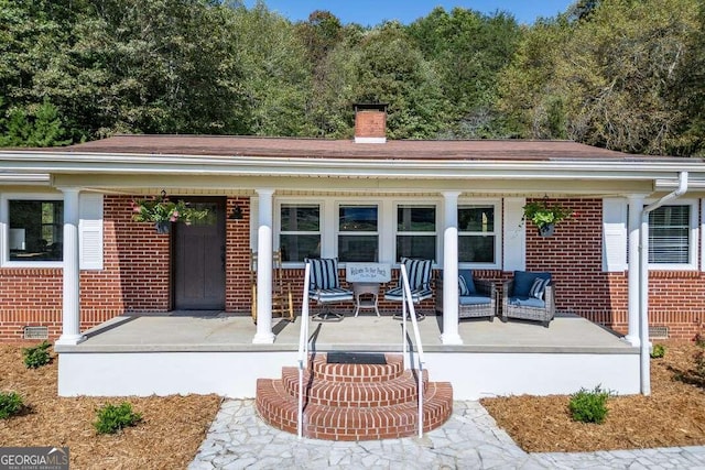 property entrance featuring covered porch