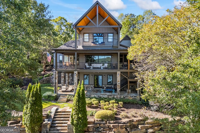 back of house featuring a patio and a balcony