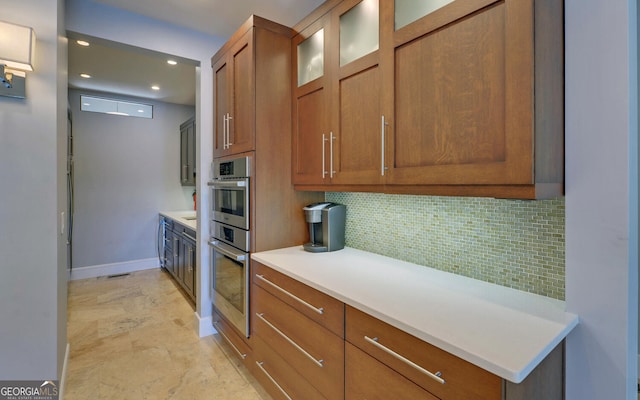 kitchen featuring tasteful backsplash and stainless steel double oven