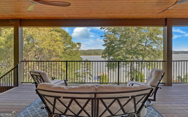 deck with outdoor lounge area and ceiling fan