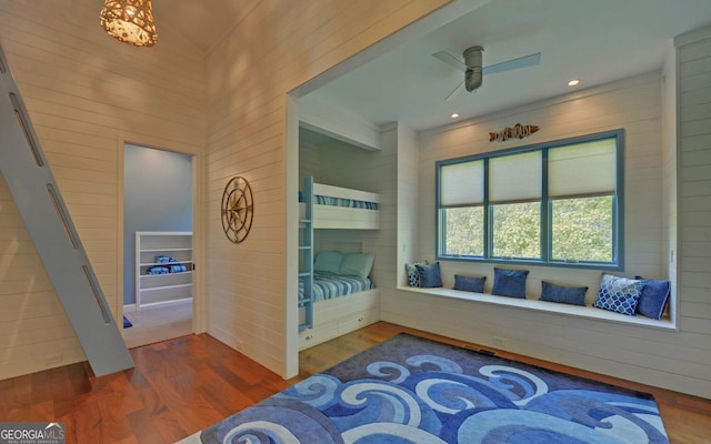 bedroom with ceiling fan and dark hardwood / wood-style flooring