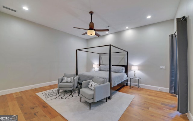 bedroom featuring light hardwood / wood-style flooring and ceiling fan