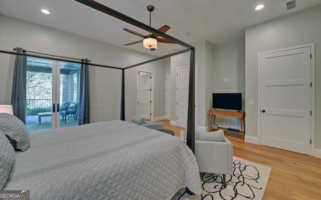 bedroom featuring access to outside, light hardwood / wood-style floors, and ceiling fan