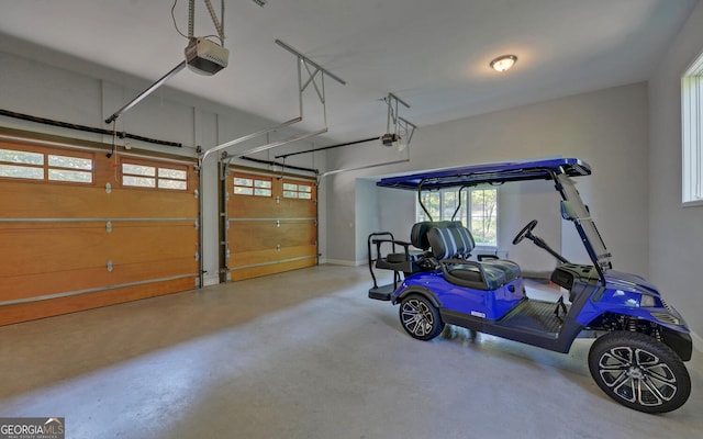 garage featuring a garage door opener