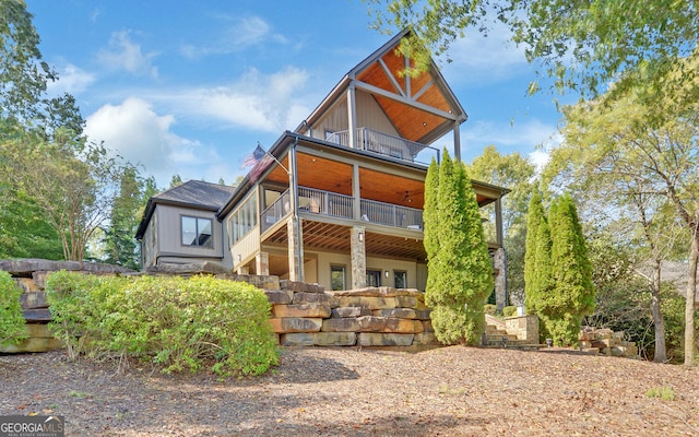 back of property with a balcony