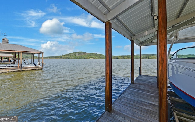 view of dock with a water view