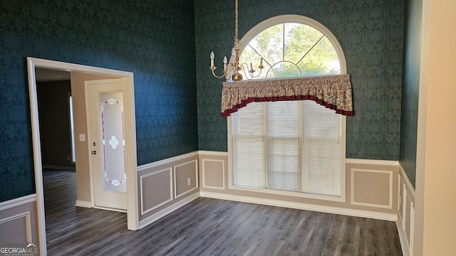 unfurnished dining area with hardwood / wood-style floors