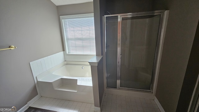 bathroom with separate shower and tub and tile patterned floors