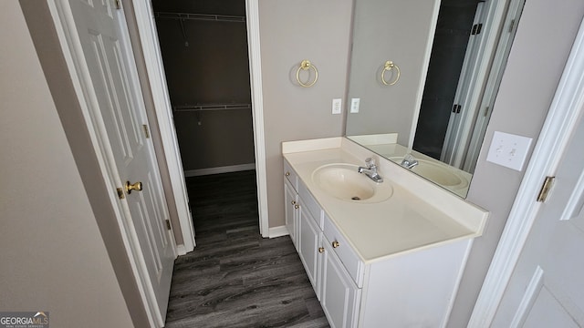 bathroom featuring vanity and wood-type flooring