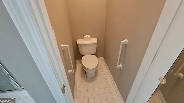 bathroom featuring tile patterned floors and toilet