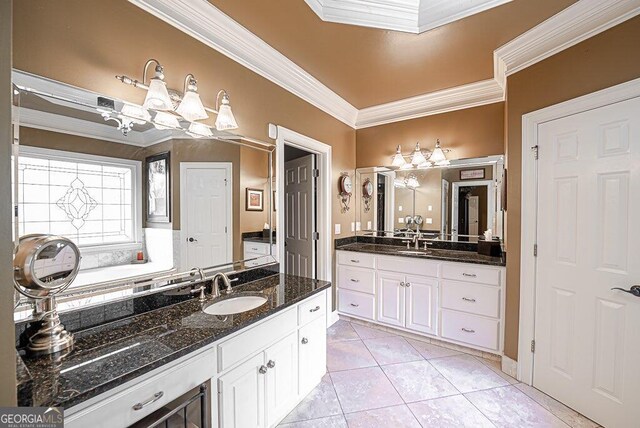 bathroom with vanity, crown molding, and tile patterned flooring