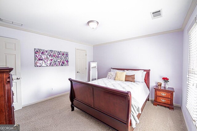 carpeted bedroom with ornamental molding