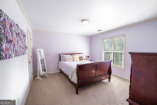 bedroom with ornamental molding and light carpet