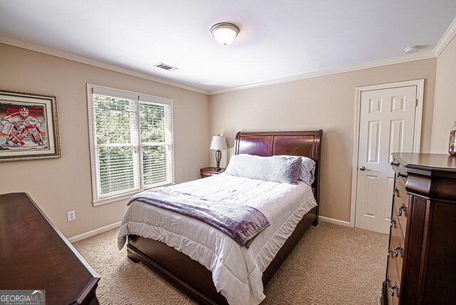 bedroom with light colored carpet and ornamental molding