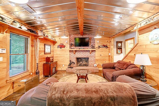 living room featuring a brick fireplace, vaulted ceiling with beams, and wood walls