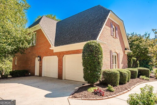 view of property exterior with a garage