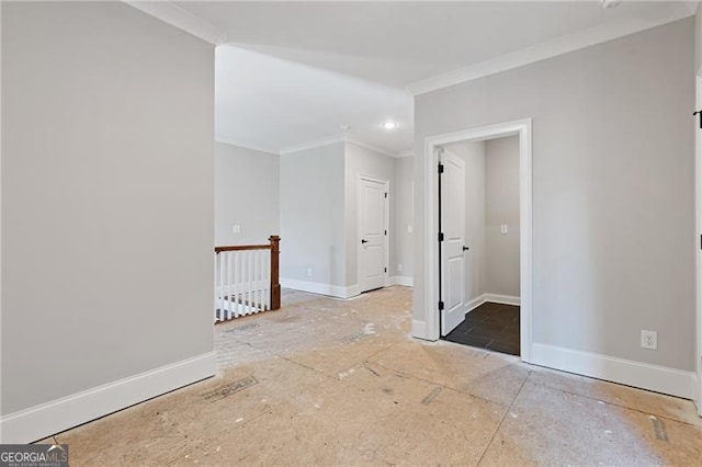 unfurnished room featuring crown molding