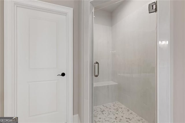 bathroom featuring an enclosed shower