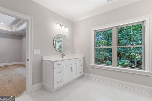 bathroom with ornamental molding and vanity