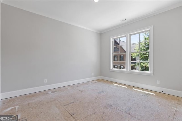 spare room featuring ornamental molding