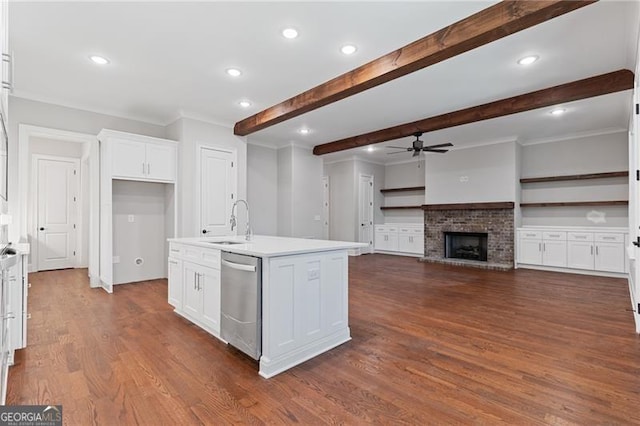 kitchen with beamed ceiling, a kitchen island with sink, dishwasher, dark hardwood / wood-style floors, and white cabinetry