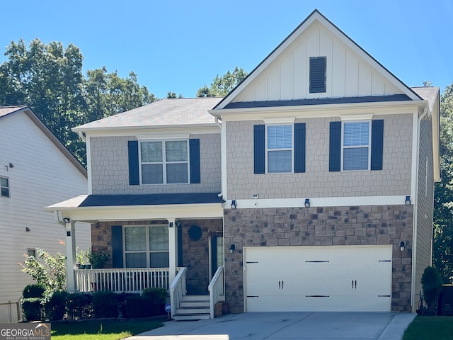 view of front of home with a porch and a garage