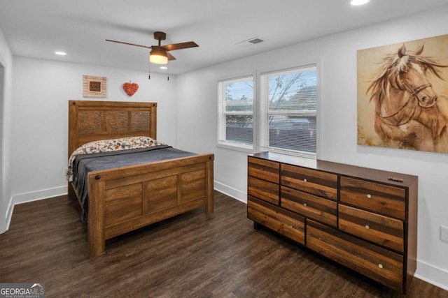 bedroom with ceiling fan and dark hardwood / wood-style floors