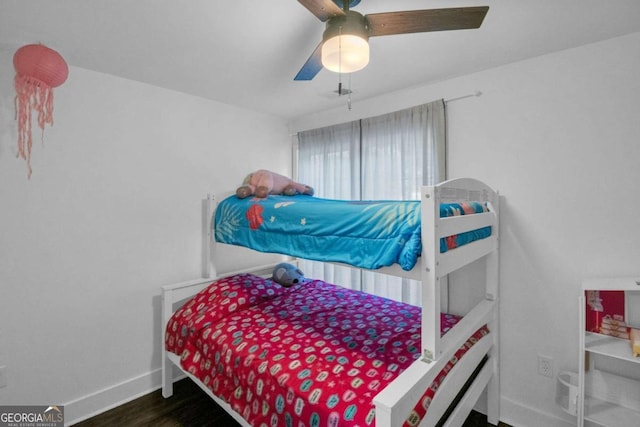 bedroom featuring ceiling fan and dark hardwood / wood-style flooring