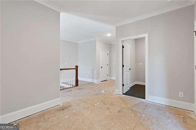 empty room featuring ornamental molding