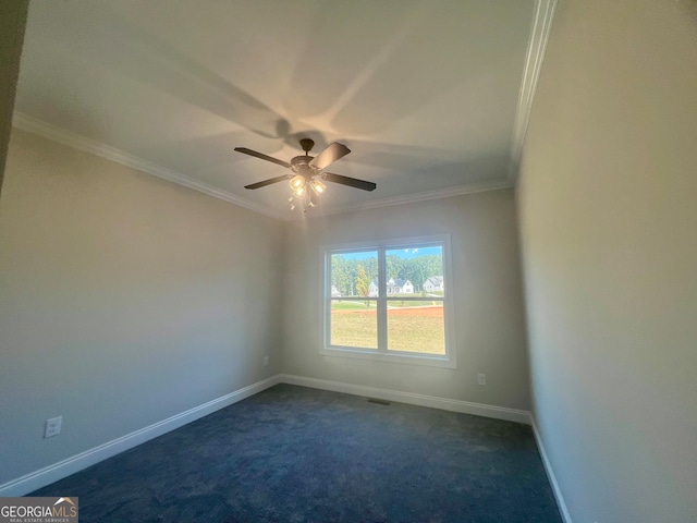 empty room with ceiling fan, ornamental molding, and dark carpet