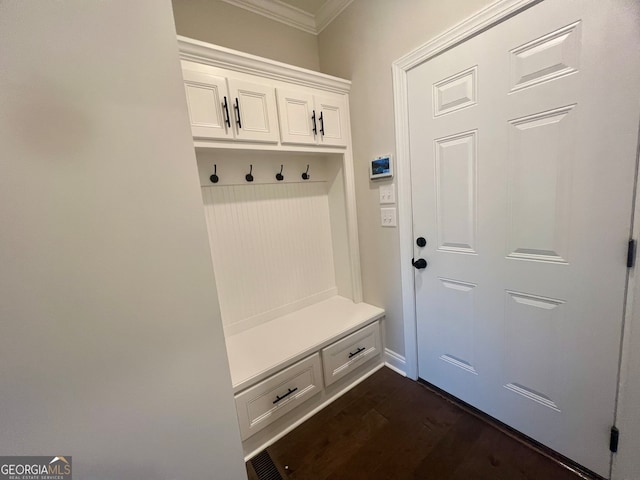 mudroom featuring crown molding and dark hardwood / wood-style floors