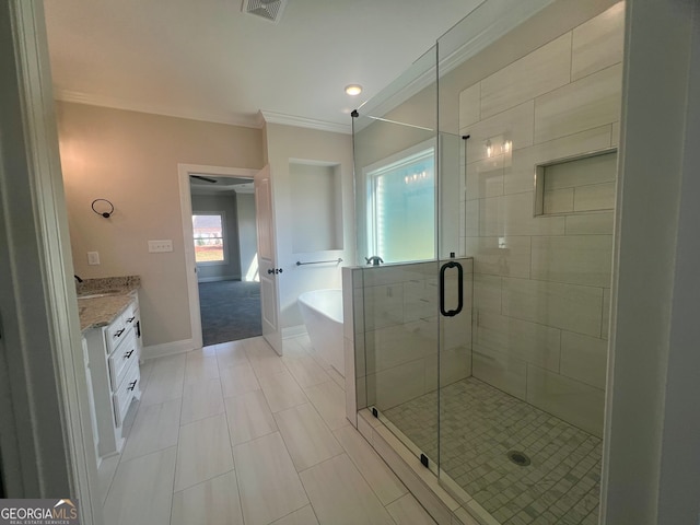 bathroom with tile patterned floors, crown molding, vanity, and plus walk in shower