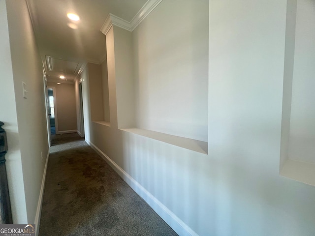 corridor featuring ornamental molding and carpet flooring