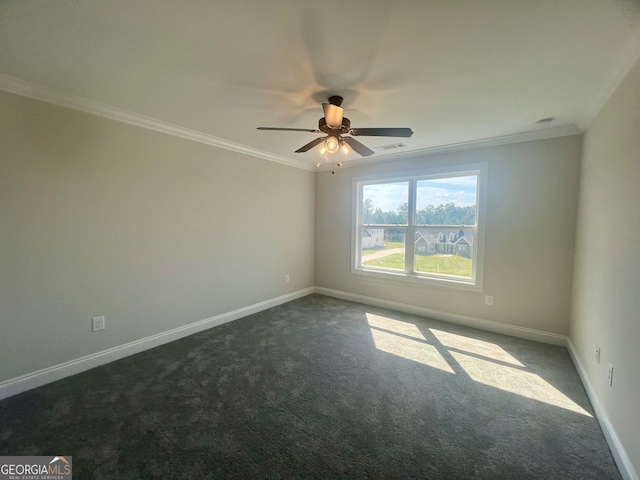 empty room featuring ornamental molding, ceiling fan, and dark carpet