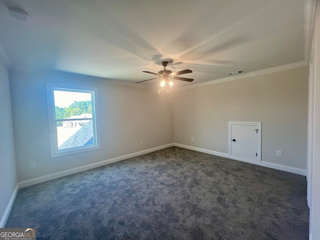 carpeted spare room featuring crown molding and ceiling fan