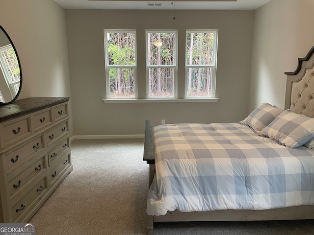 bedroom with light colored carpet