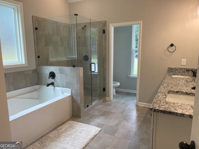 full bathroom with independent shower and bath, vanity, and toilet