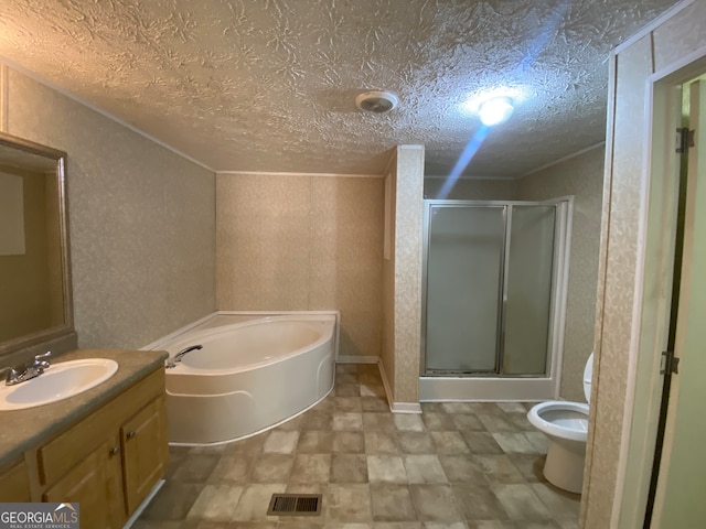 full bathroom with separate shower and tub, toilet, vanity, and a textured ceiling