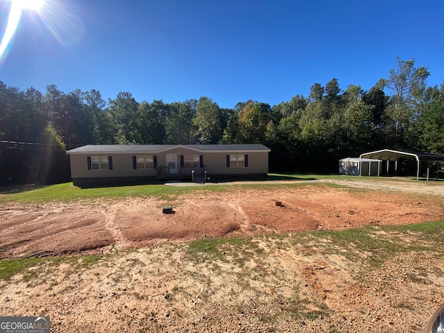 view of front of home featuring a carport