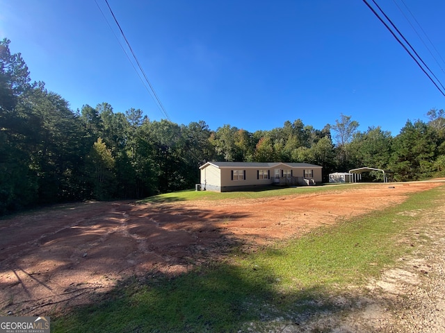 view of yard with a carport