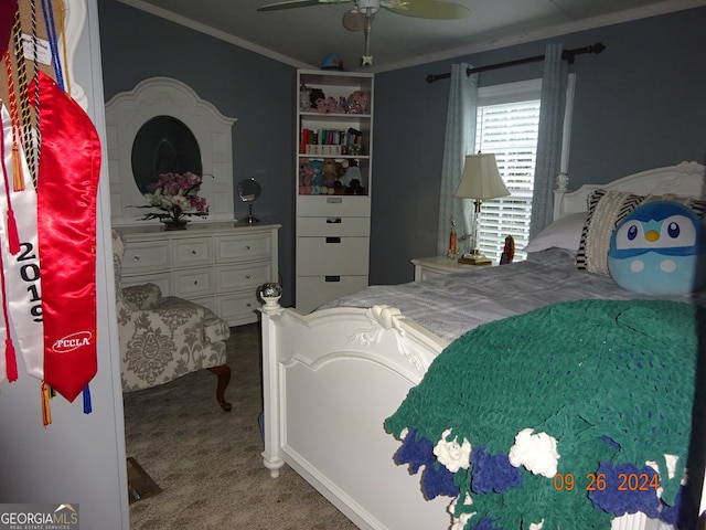 carpeted bedroom with crown molding and ceiling fan